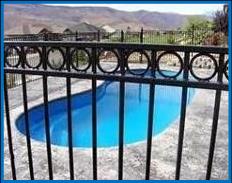 Picture of Pool Fence with double rail with circles on top.