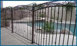 Custom pool fence:  pool fence with arches, double rails, scrolls and knuckles.